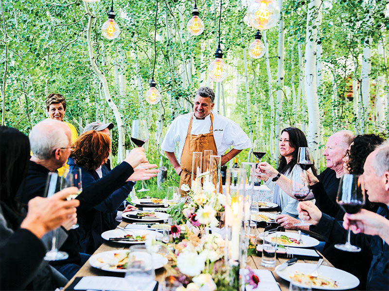 Chef John Murcko of Park City’s Firewood Dinning with friends_SLM JA24__Firewood Murcko aframedinner
