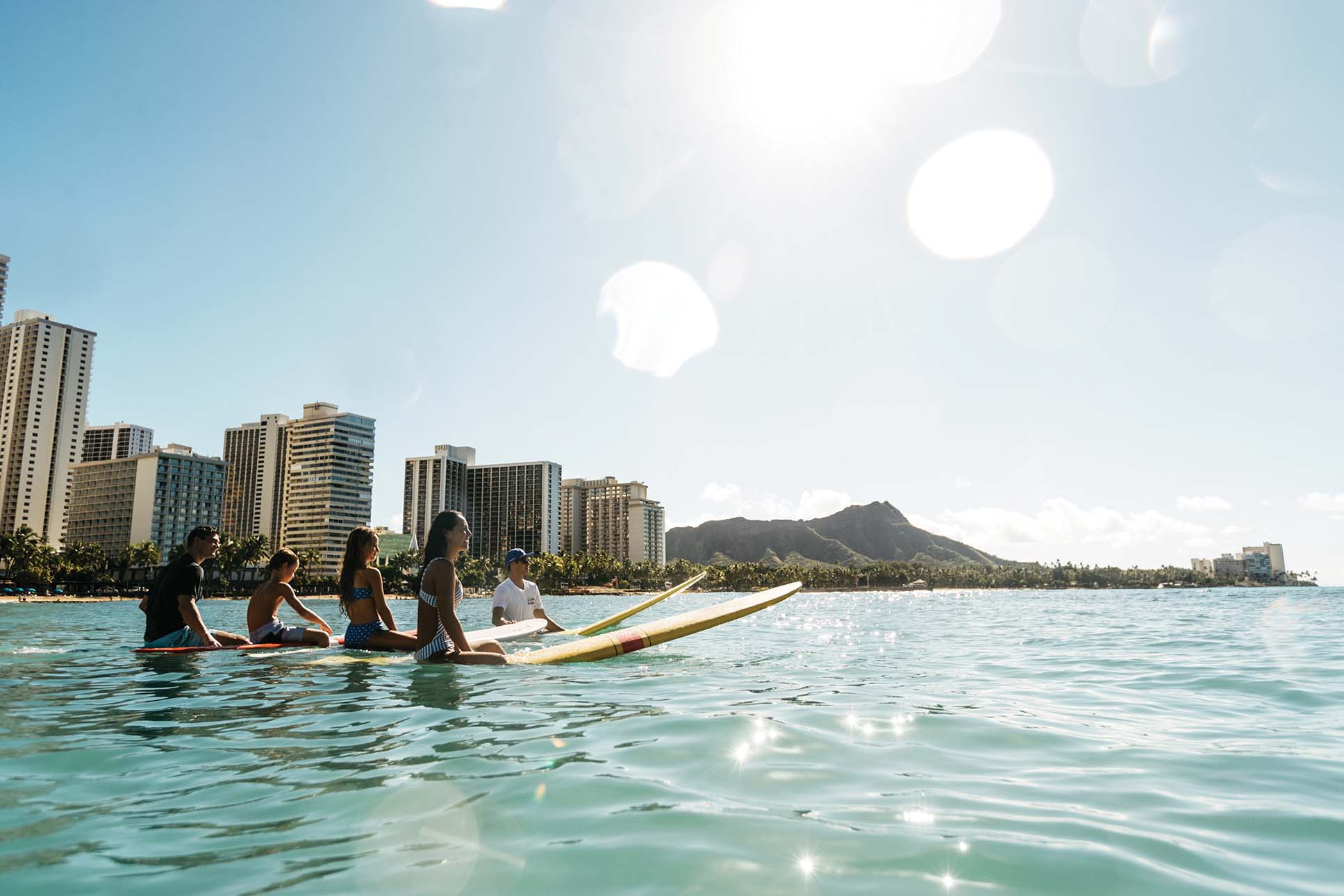 Family Surfing at Waikiki beach_SLM ND24_Hawaii Tourism Authority