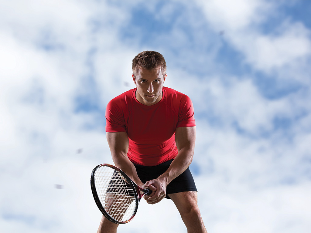 Opener_Man with tennis racket with sky in background_SLMMJ24_AdobeStock_592382182