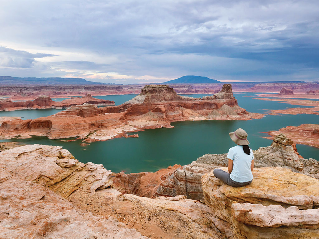 Woman Overlooking Powell_SLMJA24_AdobeStock_69507832_Sumikophoto