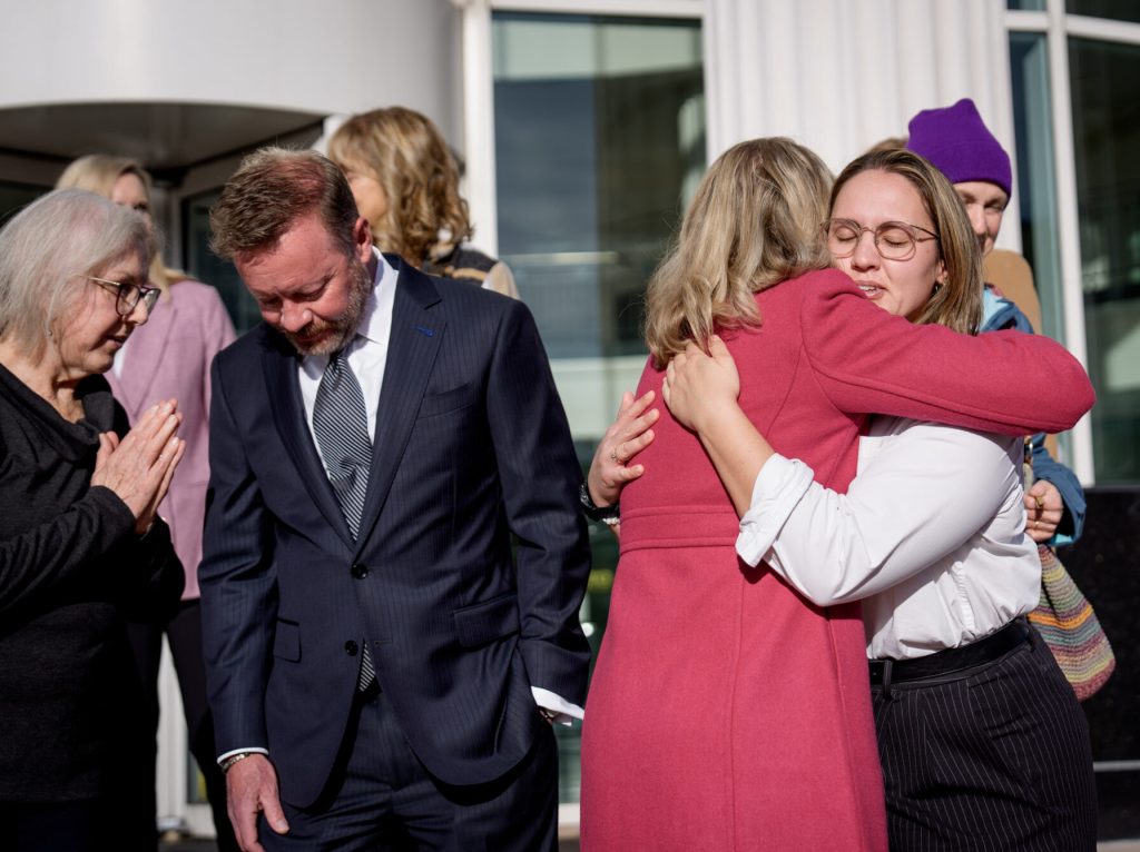 Emma Petty-Addams, co-executive director of Mormon Women for Ethical Government, and Elizabeth Rasmussen, executive director of Better Boundaries, who represent two groups that sued the Utah Legislature over their congressional maps, embrace after a press conference outside the Third District Courthouse in Salt Lake City on Tuesday, Nov. 11, 2025. Late the night before, 3rd District Judge Dianna Gibson ruled in favor of the plaintiffs, choosing their submitted map to be used in the 2026 elections. (Photo by Spenser Heaps for Utah News Dispatch)