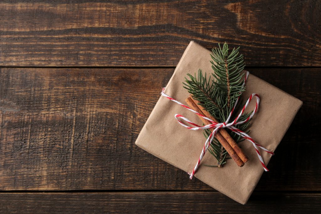 New Year. Christmas. Holidays. Composition with new year and christmas gifts on brown wooden background. view from above