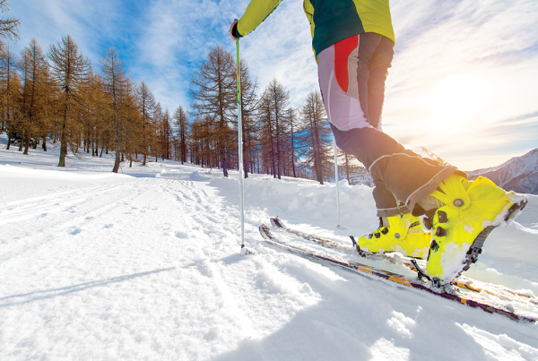 uphill skiing, backcountry skiing, adobe stock