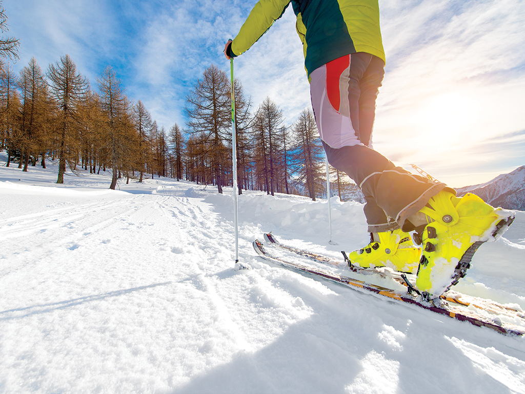 uphill skiing, backcountry skiing, adobe stock