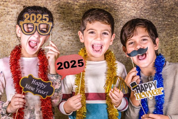 Three kids celebrating new year's