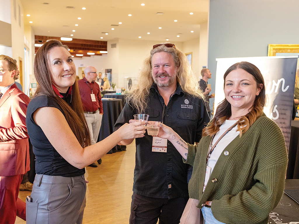 Elisabeth Osmeloski of Scion Cider, Chad Hopkins and Maddie Villano of Hopkins Brewing. 