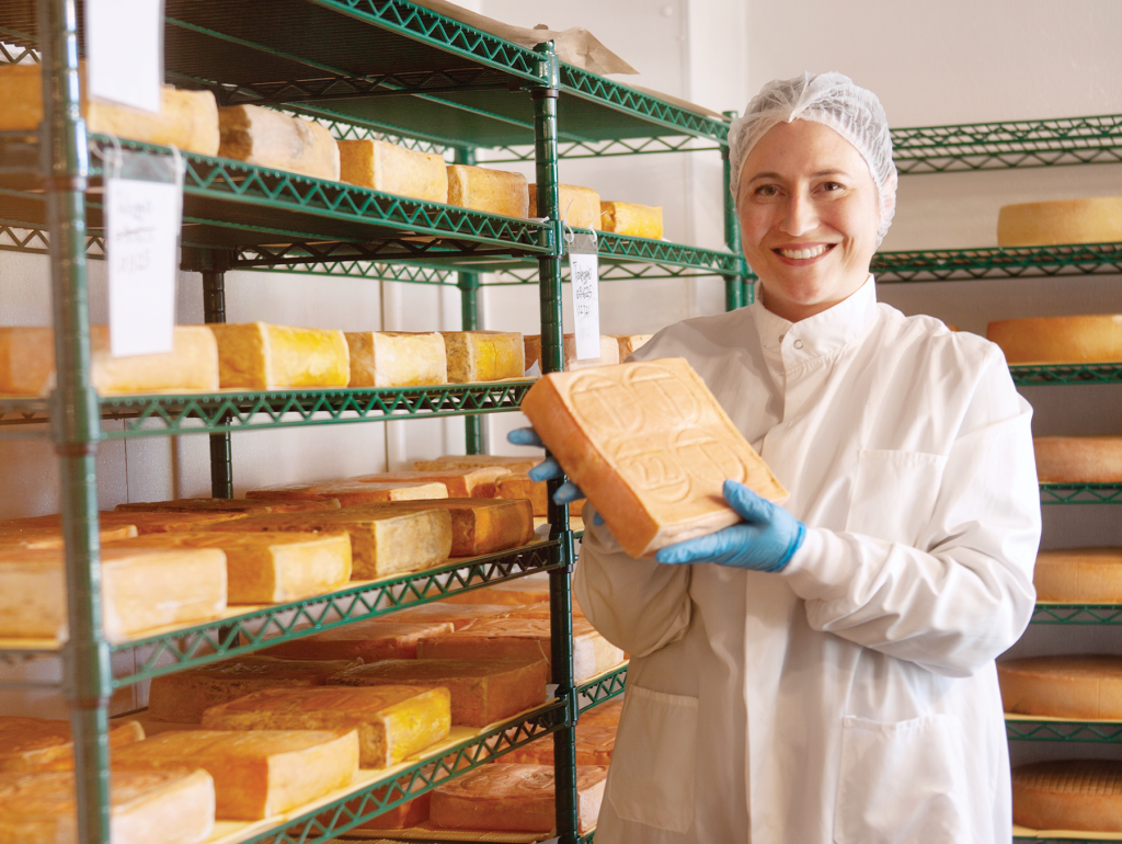Antonia Horne, the affineur at Caputo’s Market & Deli, spends her days coaxing cheese to perfection through aging, flipping, brushing, bathing, massaging and tasting cheese in the Caputo’s cheese “caves.”