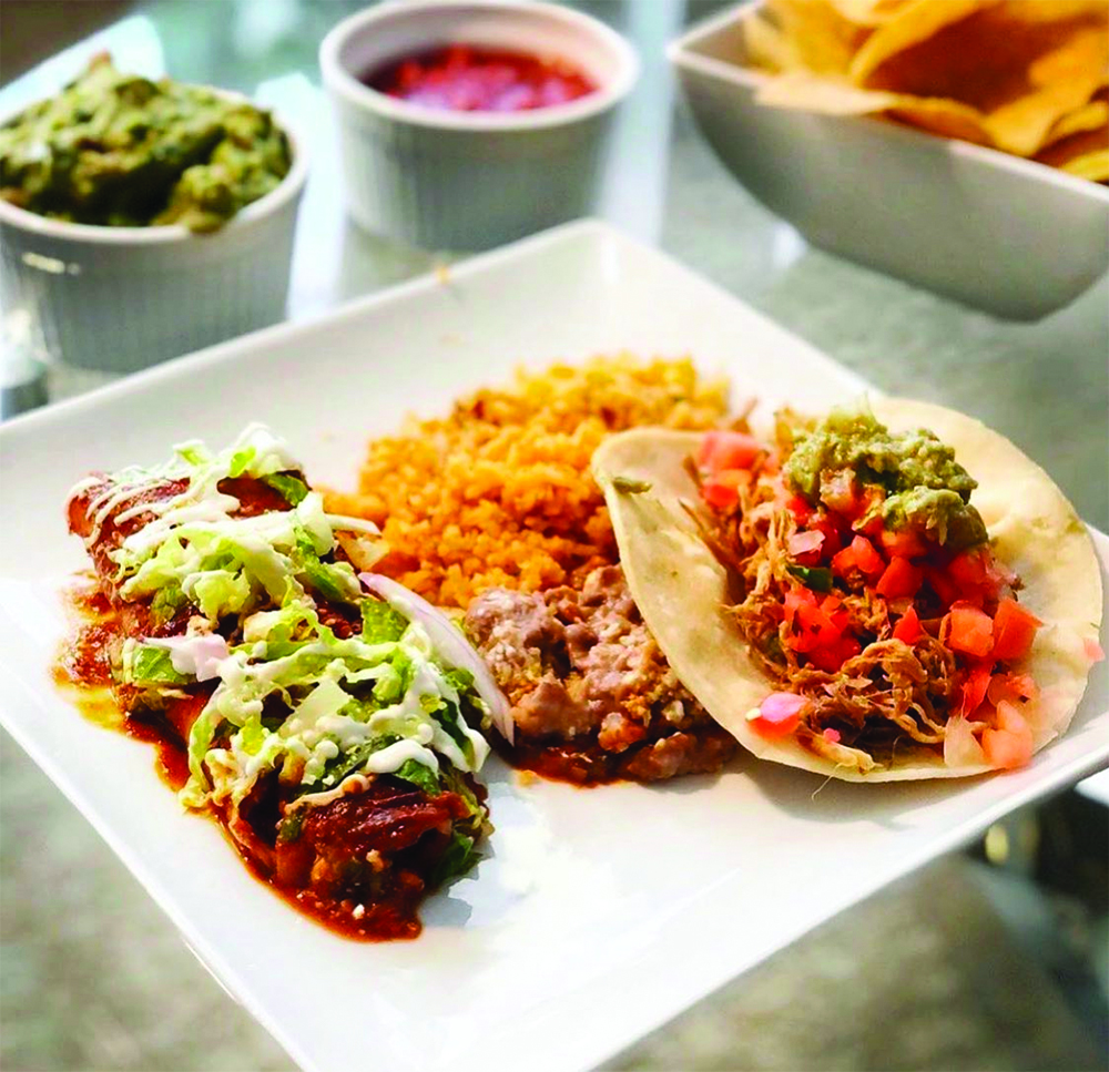 Enchilada, rice, beans and taco from Chile-Tepin