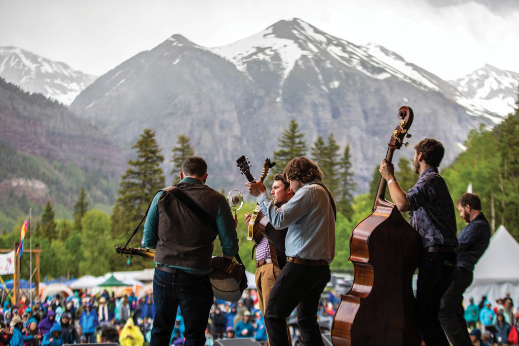 5 musicians perform for a crowd outdoors at the Telluride Bluegrass Festival