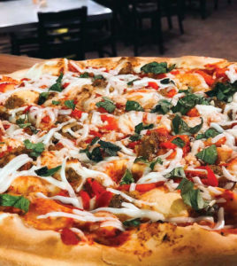 Vegan, thin-crust pizza from Este Pizza, a spot for allergy-friendly takeout in Utah