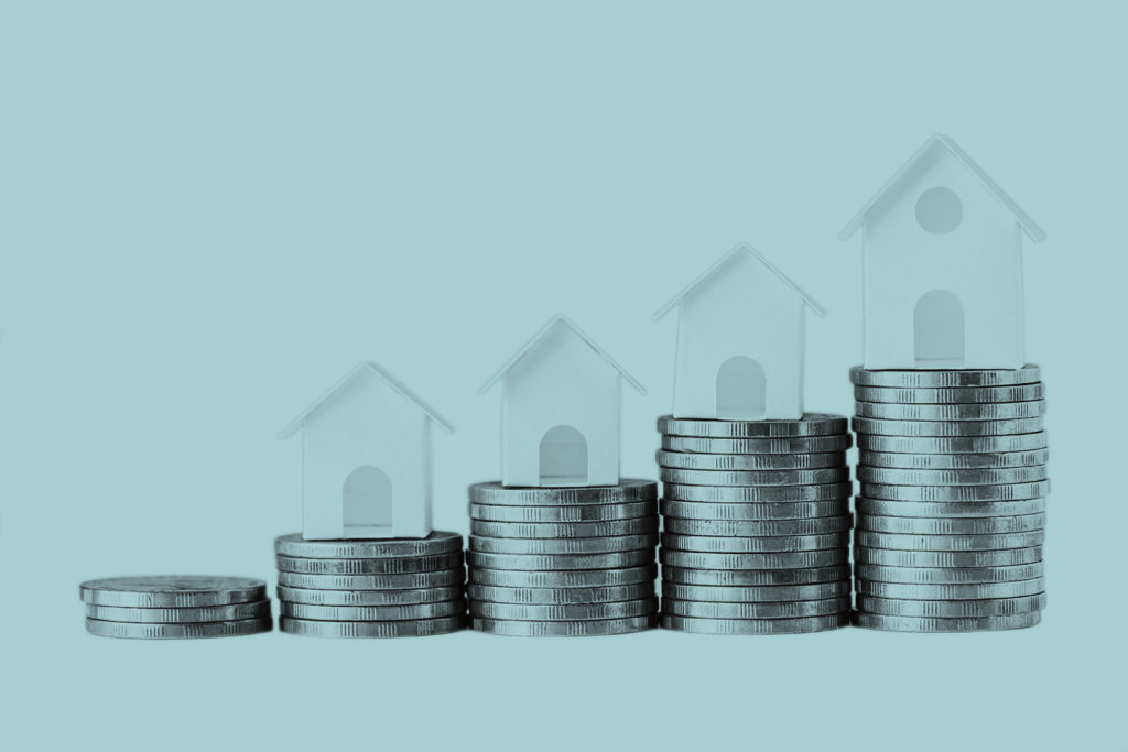 Graphic with rising houses and coins