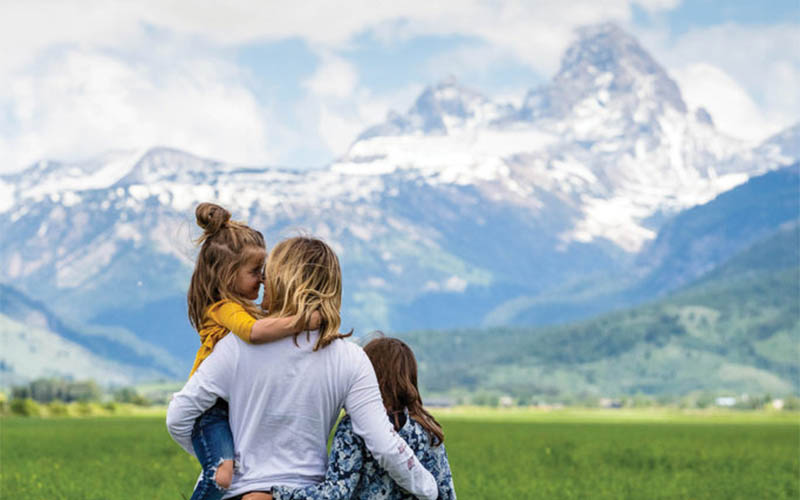 Three women stand in Teton Valley, near Driggs, Idaho