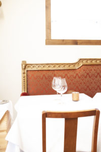 Table setting with wine glasses at Veneto