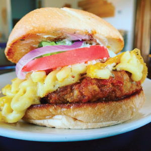 Ian Mackaye Burger with mac and cheese and vertical sauce from Verical Diner 