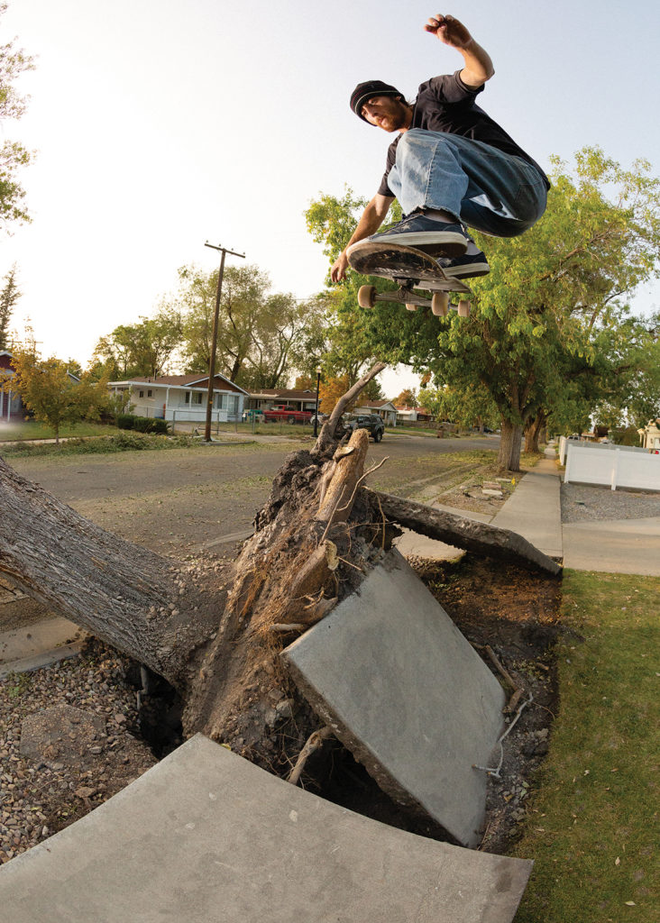 Skateboarder uses broken sidewalk as a jump after a windstorm in Rose Park