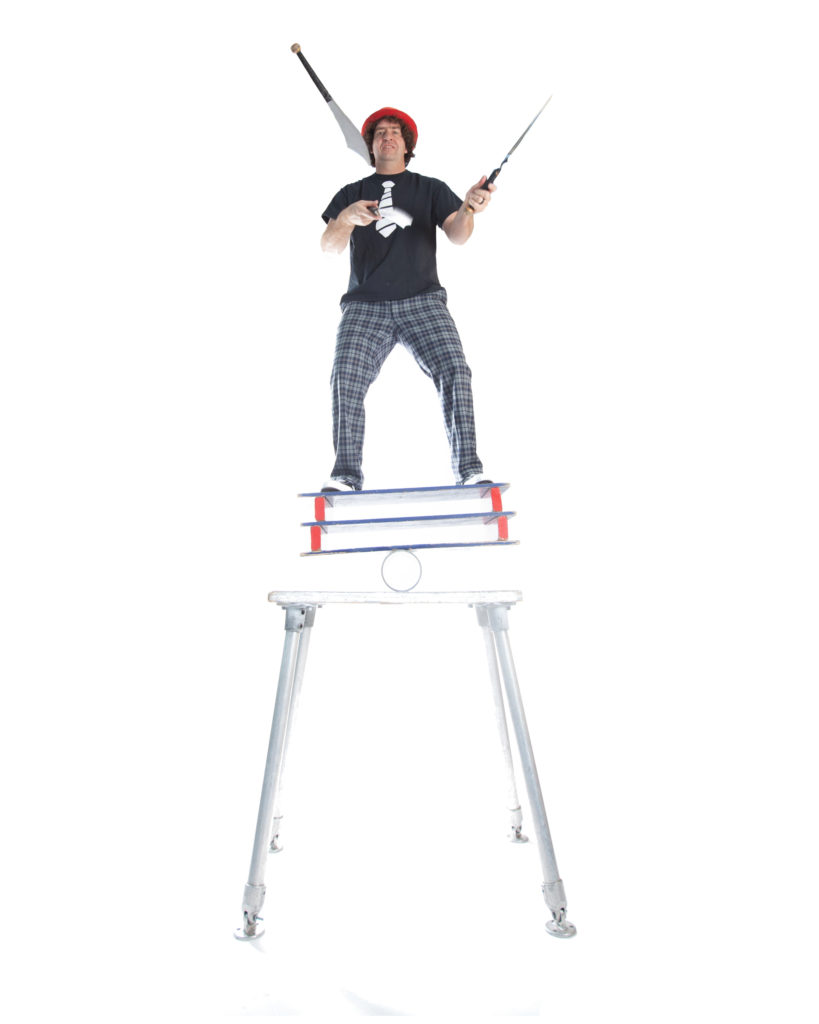 marcus wilson busker fest street performer jugglers while balancing on a platform