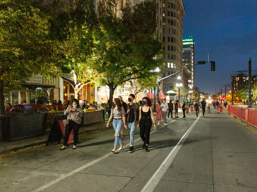 Pedestrians on Main Street enjoying SLC Open Streets.